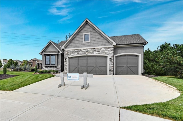 14500 Meadow Ln, Leawood, KS 66224 - view of front facade featuring a garage, driveway, stone siding, and a front lawn