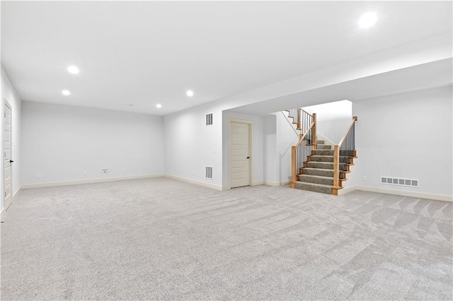 14500 Meadow Ln, Leawood, KS 66224 - finished basement with stairway, light carpet, visible vents, and recessed lighting