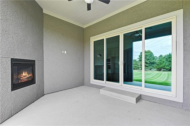 14500 Meadow Ln, Leawood, KS 66224 - view of patio / terrace with a glass covered fireplace and ceiling fan