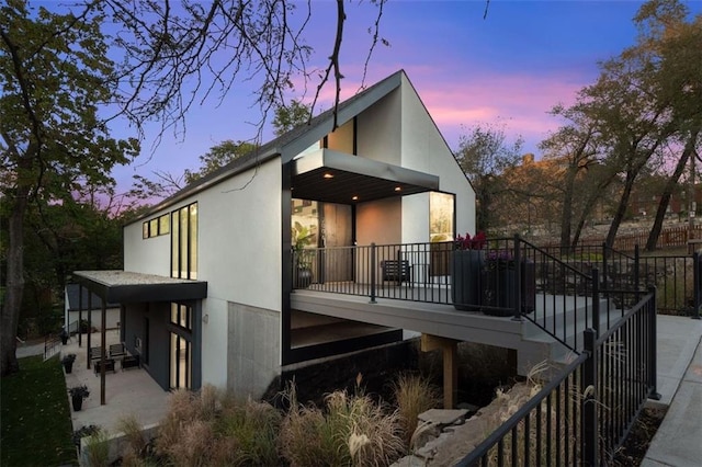 view of property exterior at dusk