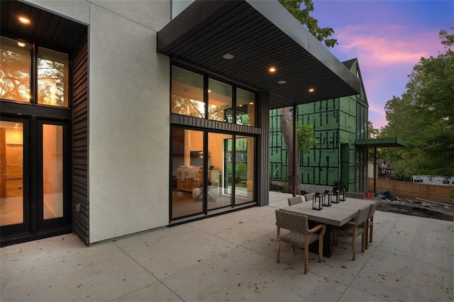 view of patio terrace at dusk