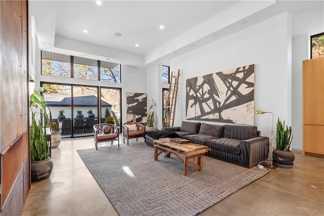 living room with a high ceiling