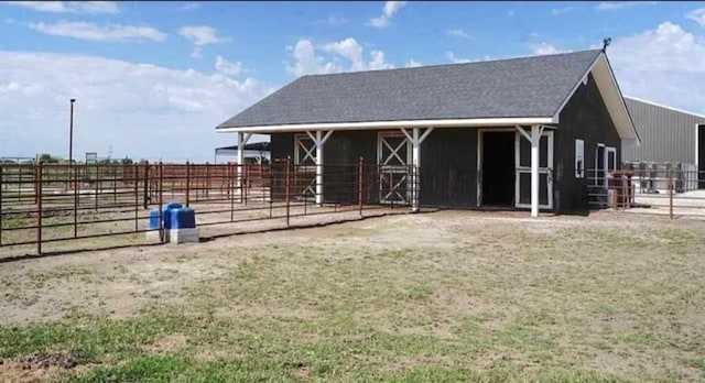 view of horse barn with an outdoor structure