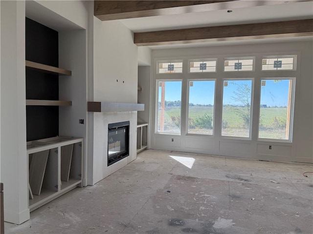 unfurnished living room featuring beam ceiling