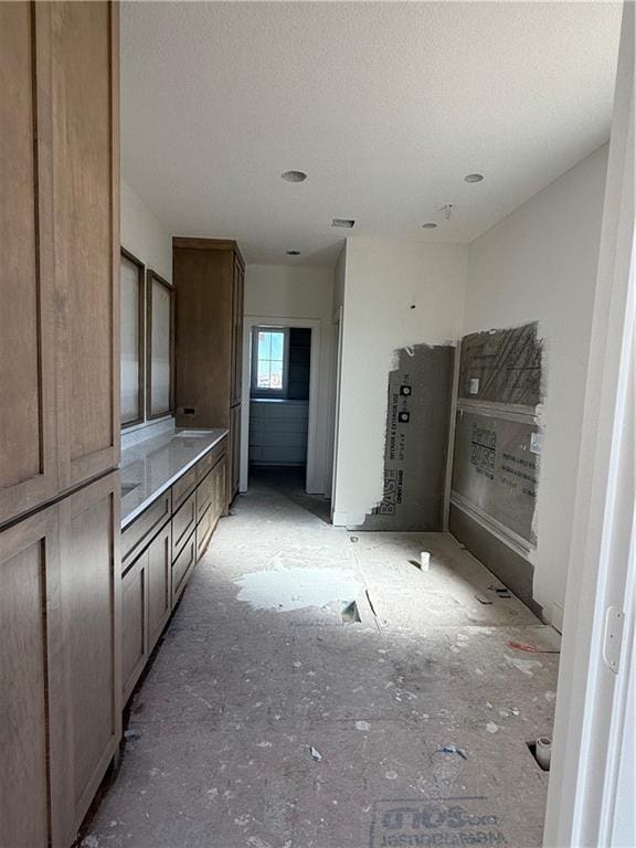 kitchen featuring a textured ceiling