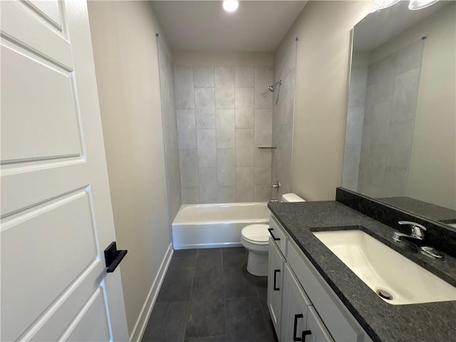 full bathroom featuring vanity, tiled shower / bath, tile patterned flooring, and toilet