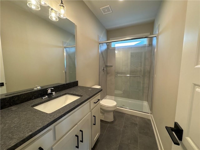 bathroom with vanity, an enclosed shower, tile patterned floors, and toilet