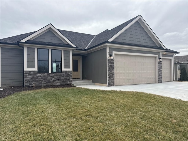 view of front of property with a garage and a front yard