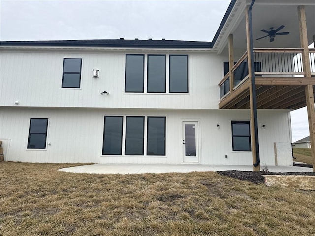 rear view of property with a patio area, ceiling fan, and a lawn