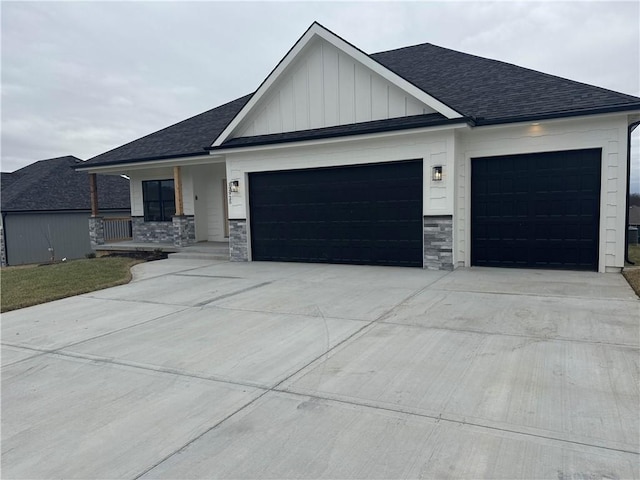 view of front of property featuring a garage and covered porch