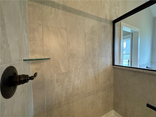 bathroom with a tile shower