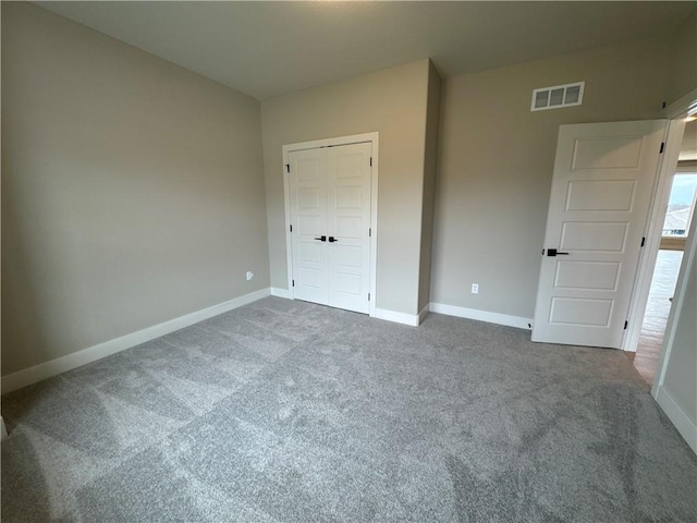 unfurnished bedroom with carpet floors