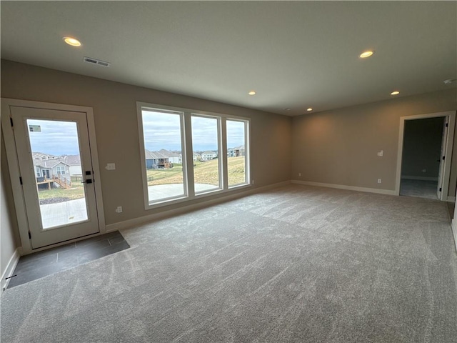 unfurnished living room with light carpet