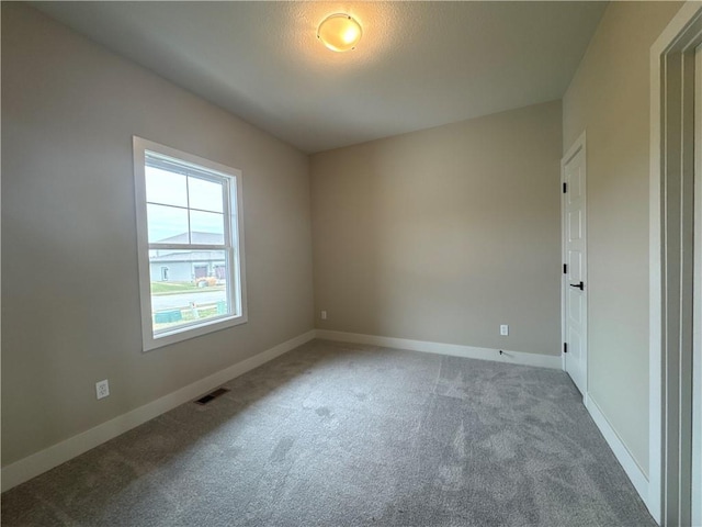 spare room with carpet flooring