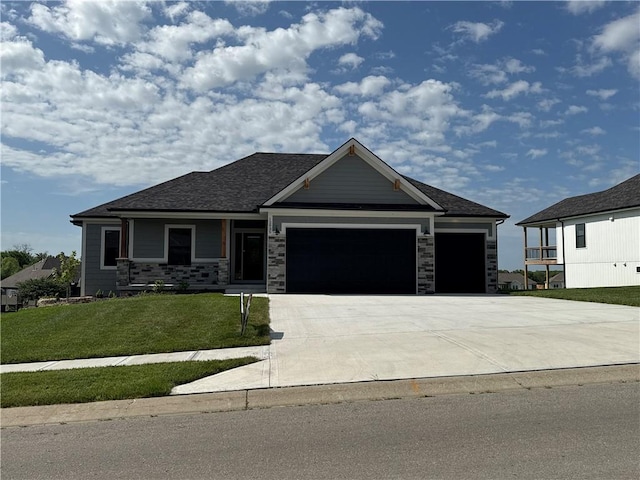 12935 N Champanel Way, Platte City, MO 64079 - view of front of house with a garage, a front yard, and concrete driveway