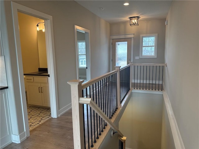 stairs with hardwood / wood-style floors