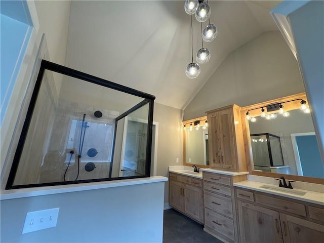 bathroom featuring vaulted ceiling, vanity, and a shower with door