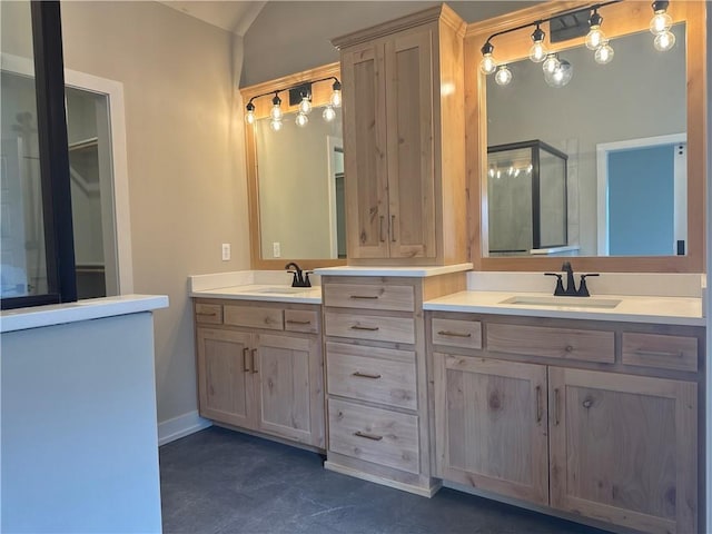 bathroom featuring vanity and vaulted ceiling