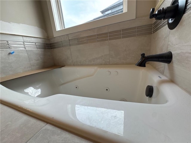 bathroom featuring a relaxing tiled tub