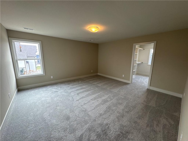 empty room with carpet flooring