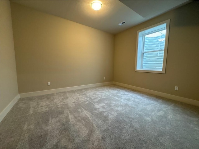 spare room featuring carpet flooring