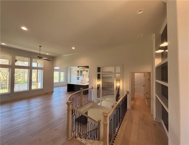 hallway with hardwood / wood-style floors