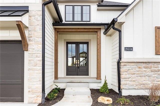 view of exterior entry with a garage