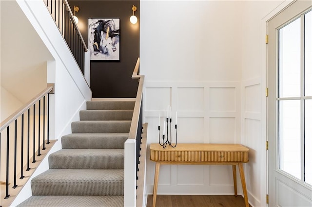 stairs with wood-type flooring