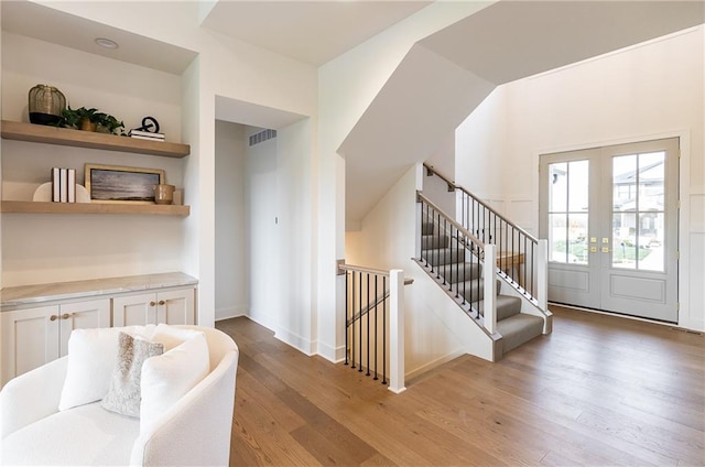 interior space featuring french doors and hardwood / wood-style floors