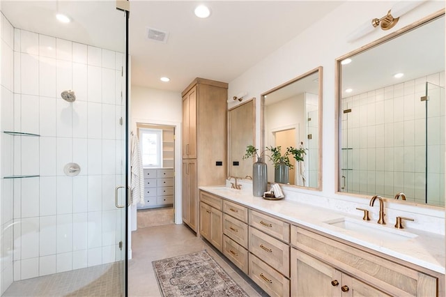 bathroom featuring vanity, concrete floors, and a shower with shower door