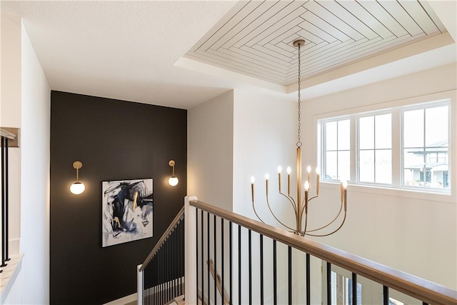 hallway featuring an inviting chandelier