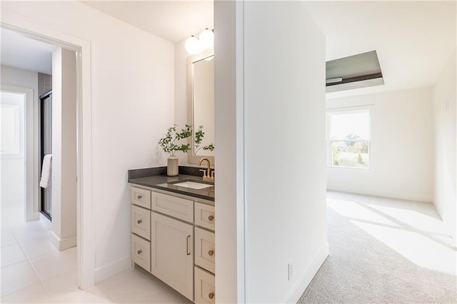 bathroom with vanity, tile patterned floors, and an enclosed shower