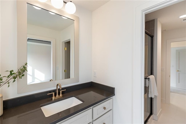 bathroom with vanity and an enclosed shower