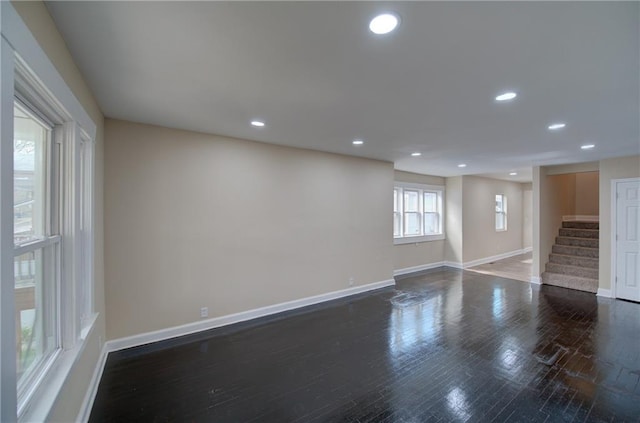 unfurnished room featuring dark hardwood / wood-style flooring