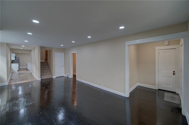 spare room featuring dark hardwood / wood-style flooring