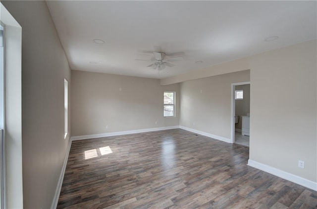 unfurnished room featuring dark hardwood / wood-style flooring and ceiling fan