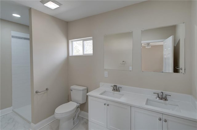 bathroom with toilet, oversized vanity, double sink, ceiling fan, and tile flooring