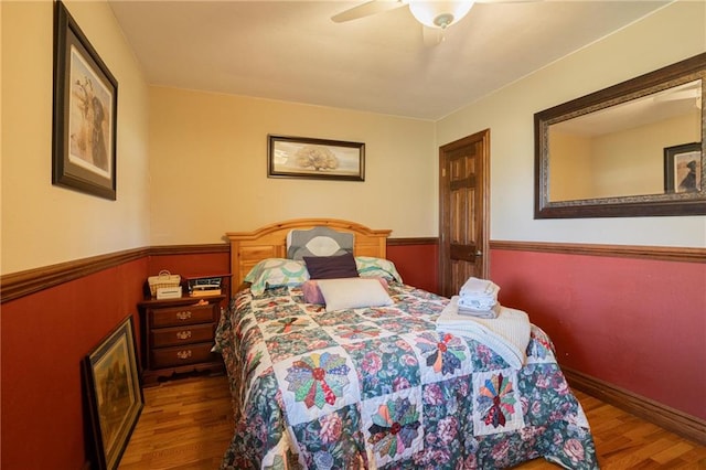 bedroom featuring dark hardwood / wood-style floors and ceiling fan