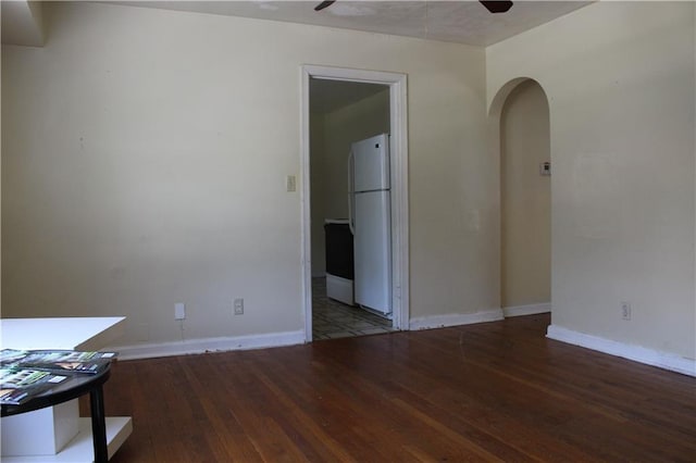 spare room with hardwood / wood-style flooring and ceiling fan