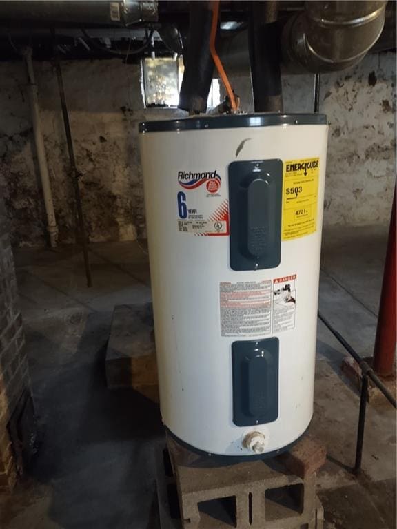 utility room with electric water heater