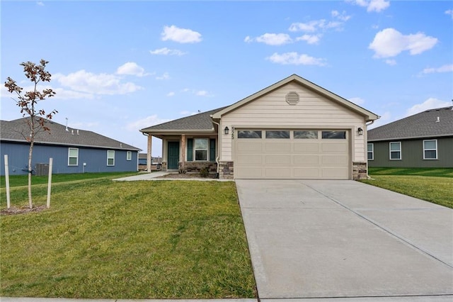 ranch-style home featuring a garage and a front lawn