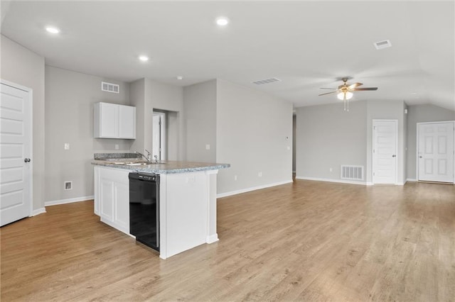 kitchen with ceiling fan, sink, black dishwasher, light hardwood / wood-style floors, and white cabinetry