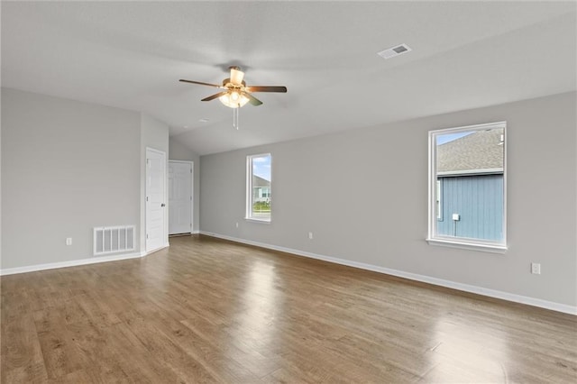 spare room featuring hardwood / wood-style floors, ceiling fan, and lofted ceiling