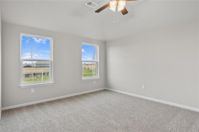 carpeted empty room featuring ceiling fan