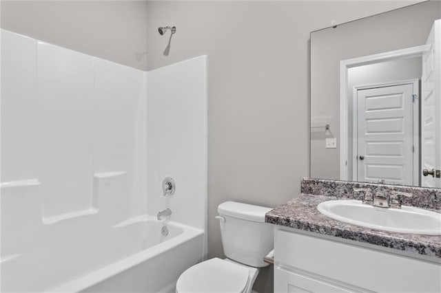 full bathroom with vanity, shower / bath combination, and toilet