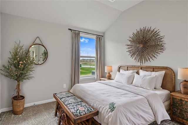 carpeted bedroom featuring lofted ceiling