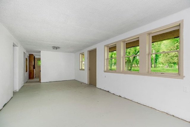 empty room featuring a textured ceiling