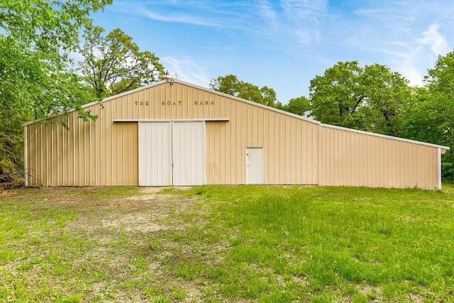 view of outdoor structure with a yard