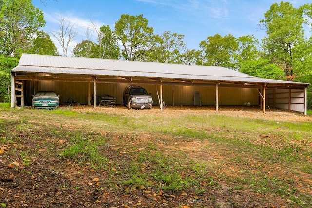 rear view of house featuring a carport