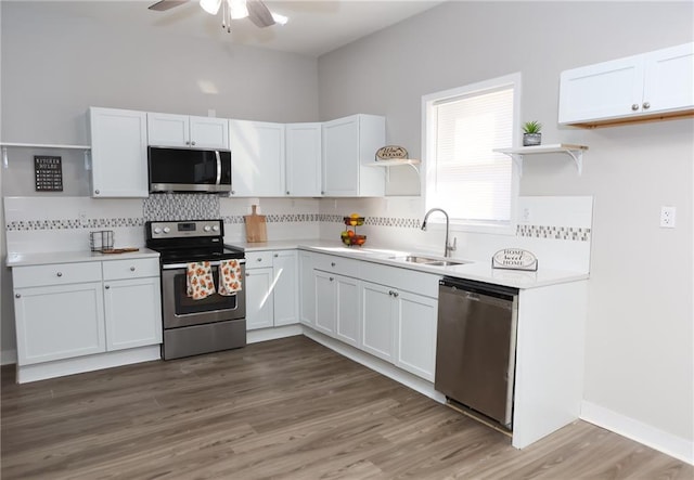 kitchen featuring white cabinets, stainless steel appliances, and ceiling fan